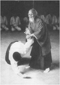 MoriheiUeshibaHandsTech O Sensei, Morehei Ueshiba, demonstrating the minimal effort and superb control of Aikido movement in resolving conflict.